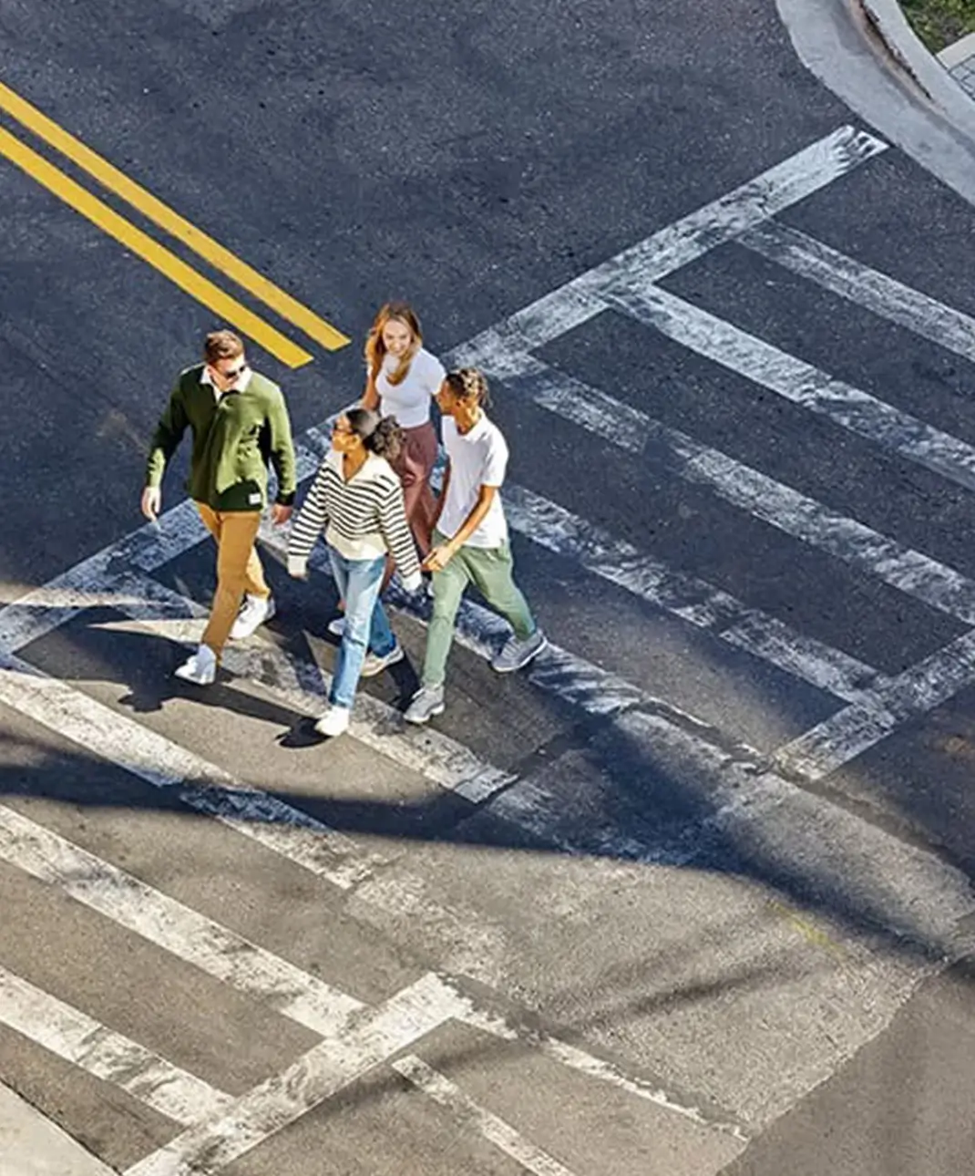 young adults crossing the street