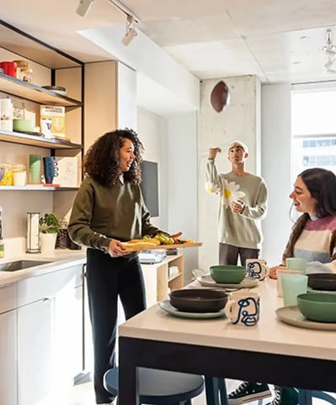resident cooking in shared kitchen space